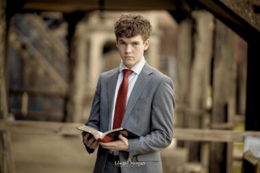 High school senior holding a Bible