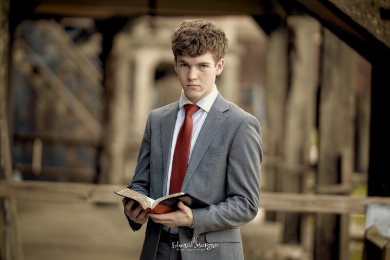High school senior holding a Bible 